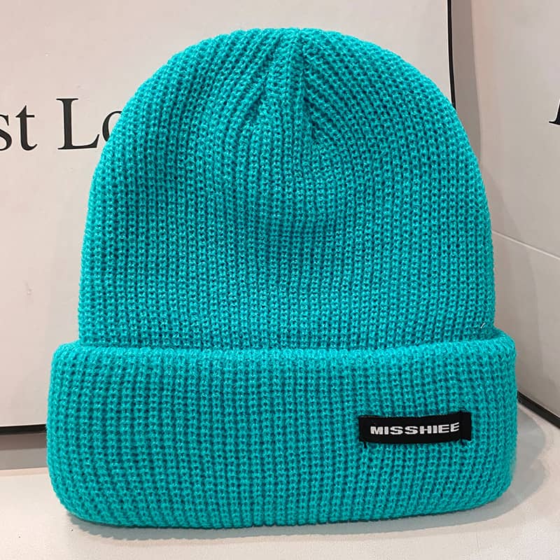 H00018 Glossy versjon Voksen strikket lue med bokstavetikett